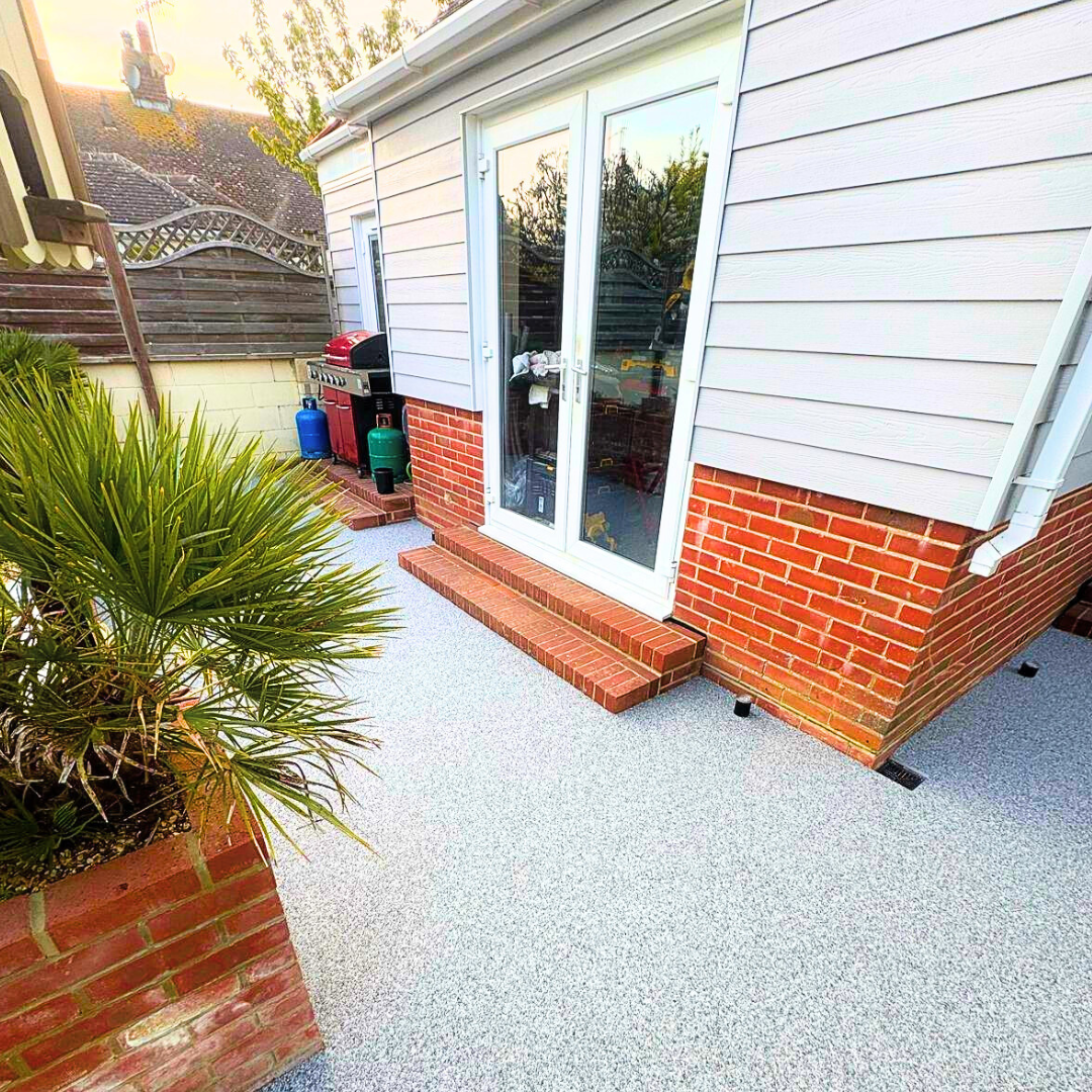 Resin patio installation with clean edge detailing