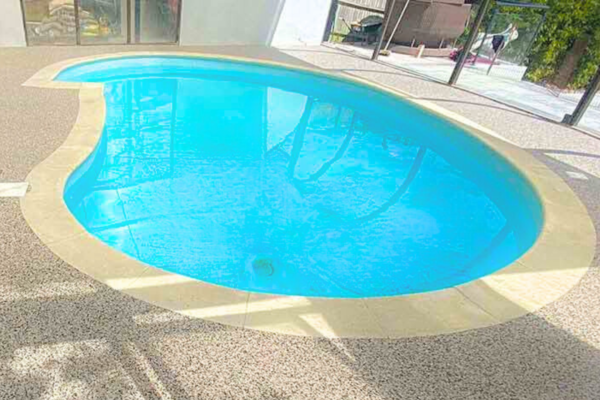 Ideas for outdoor landscaping: Perfectly porous resin pool surrounds and hot tub areas