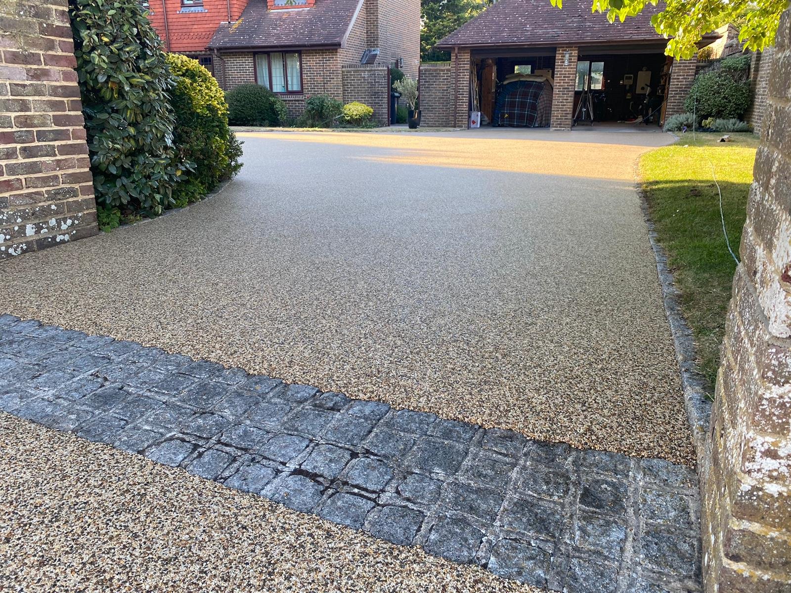 Light grey Vuba resin path with planting and a welcoming front door