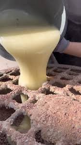 Contractor mixing resin and aggregate for a resin bound surface