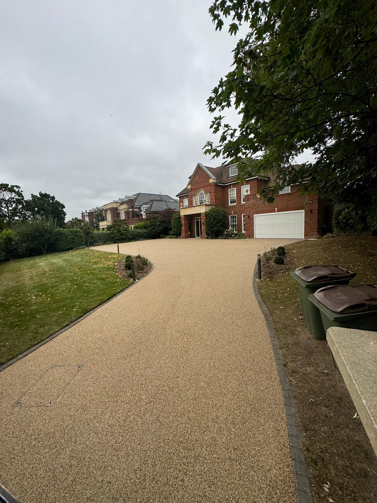 Large sloping resin driveway designed for effective drainage