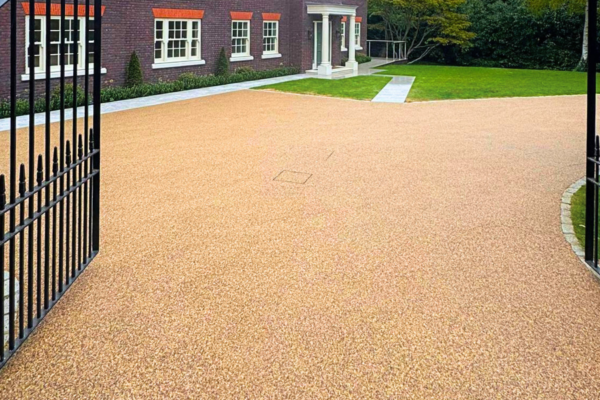 Elegant resin driveway with gated entrance