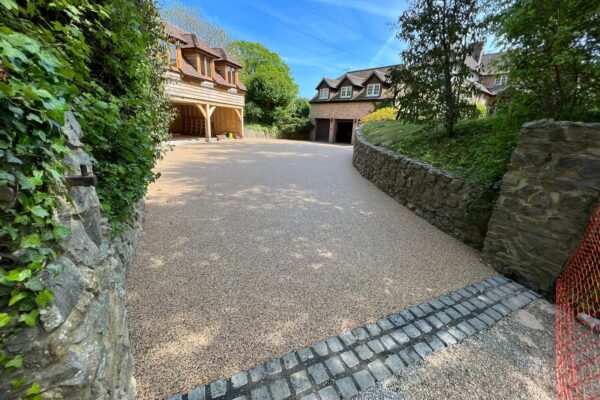 Premium resin driveway leading to houses.