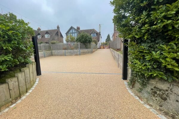 Newly installed premium resin driveway with gated entrance