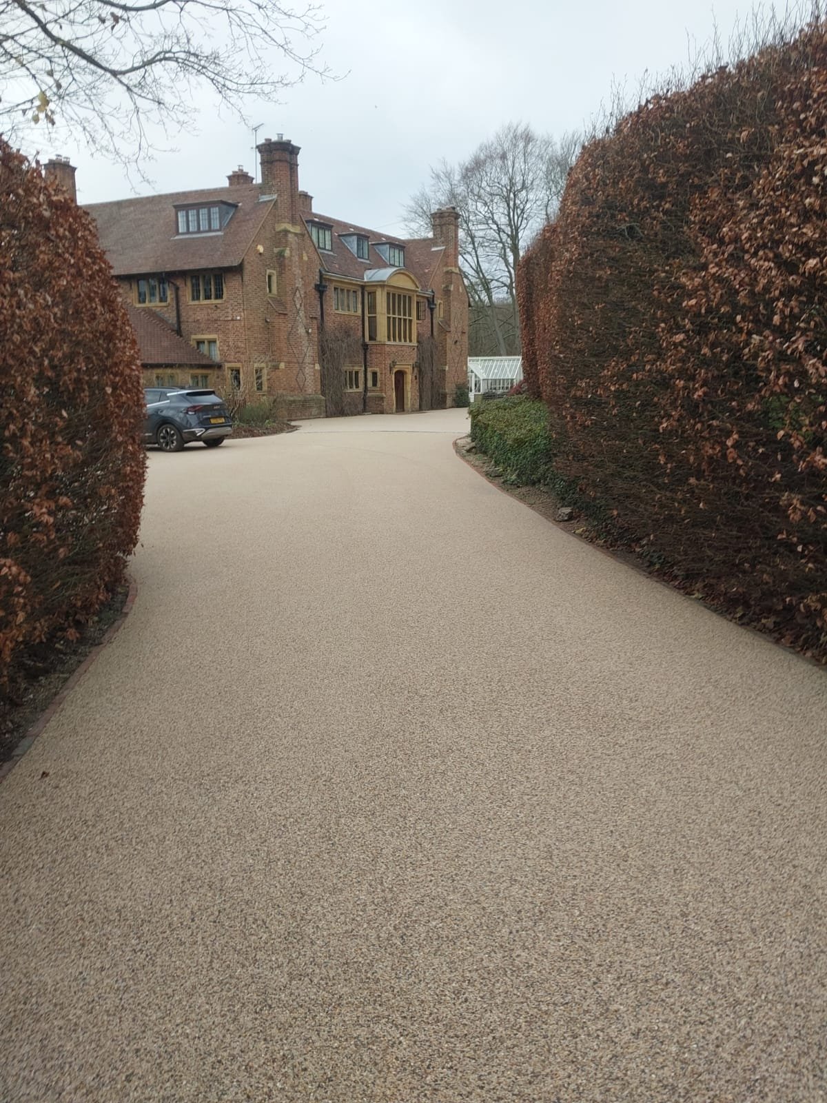 Outdoor resin driveway area with clean edging and even finish