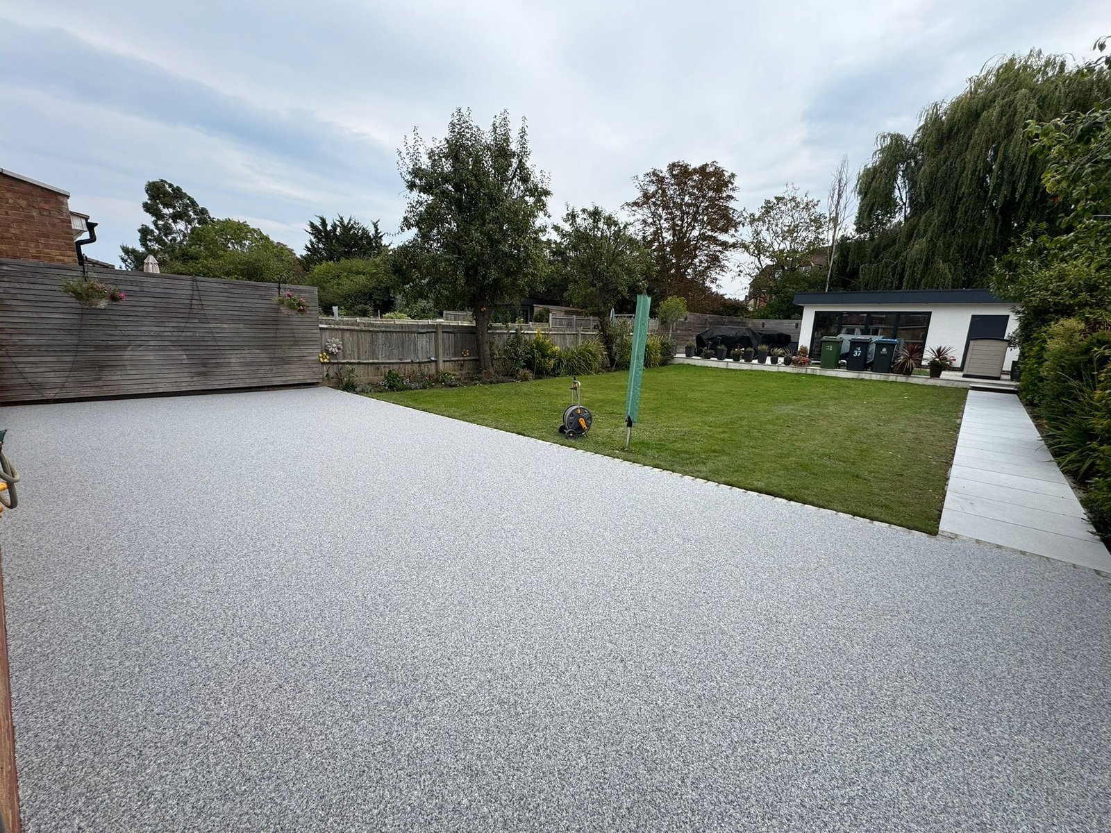 Resin patio installation in a residential garden