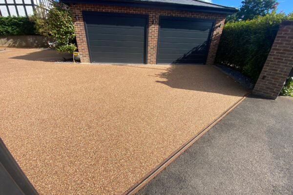 Newly surfaced resin driveway and garage area.