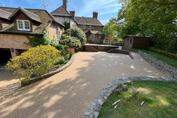 Neatly landscaped garden with gravel driveway.